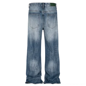Back view of vintage blue wide-leg streetwear jeans showing rear patch pockets, faded denim texture, waistband detail, and frayed hems