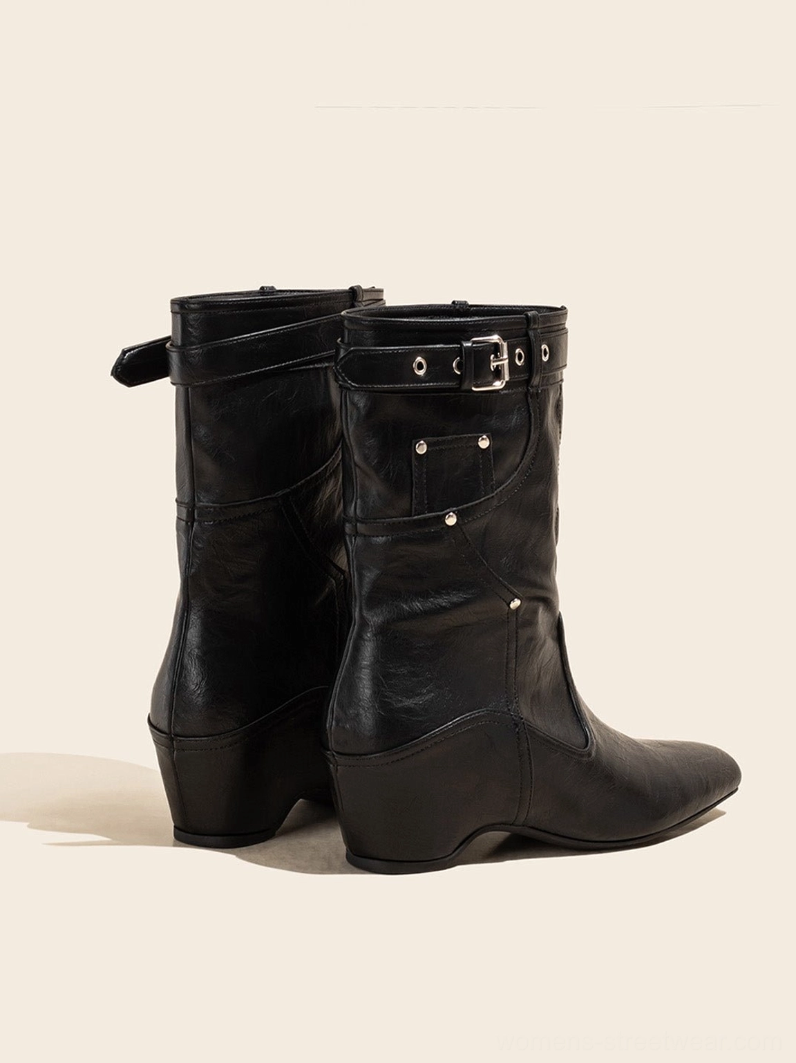 Vintage brown buckle-cuff western ankle boots close-up showing western stitching cuff strap and low heel