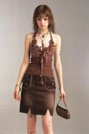 Full front view of womens vintage brown denim pencil skirt with low waist, front pockets, and slit