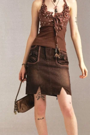 Vintage brown low-waist denim pencil skirt with front flap pockets and front hem slit in studio outfit view