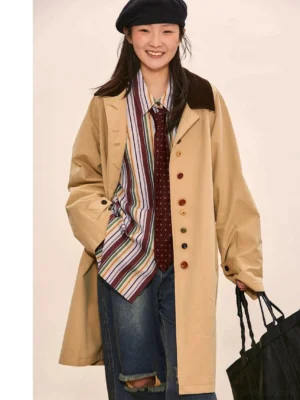 Khaki vintage oversized streetwear coat with corduroy contrast collar, colorful buttons, striped shirt, polka dot tie, ripped jeans, beret, and black tote bag