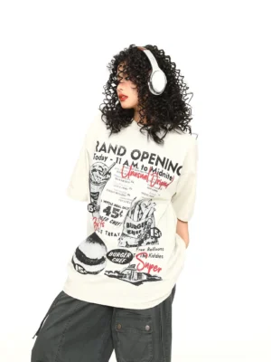 Off-white oversized vintage diner grand opening graphic T-shirt styled with dark gray cargo pants and white headphones