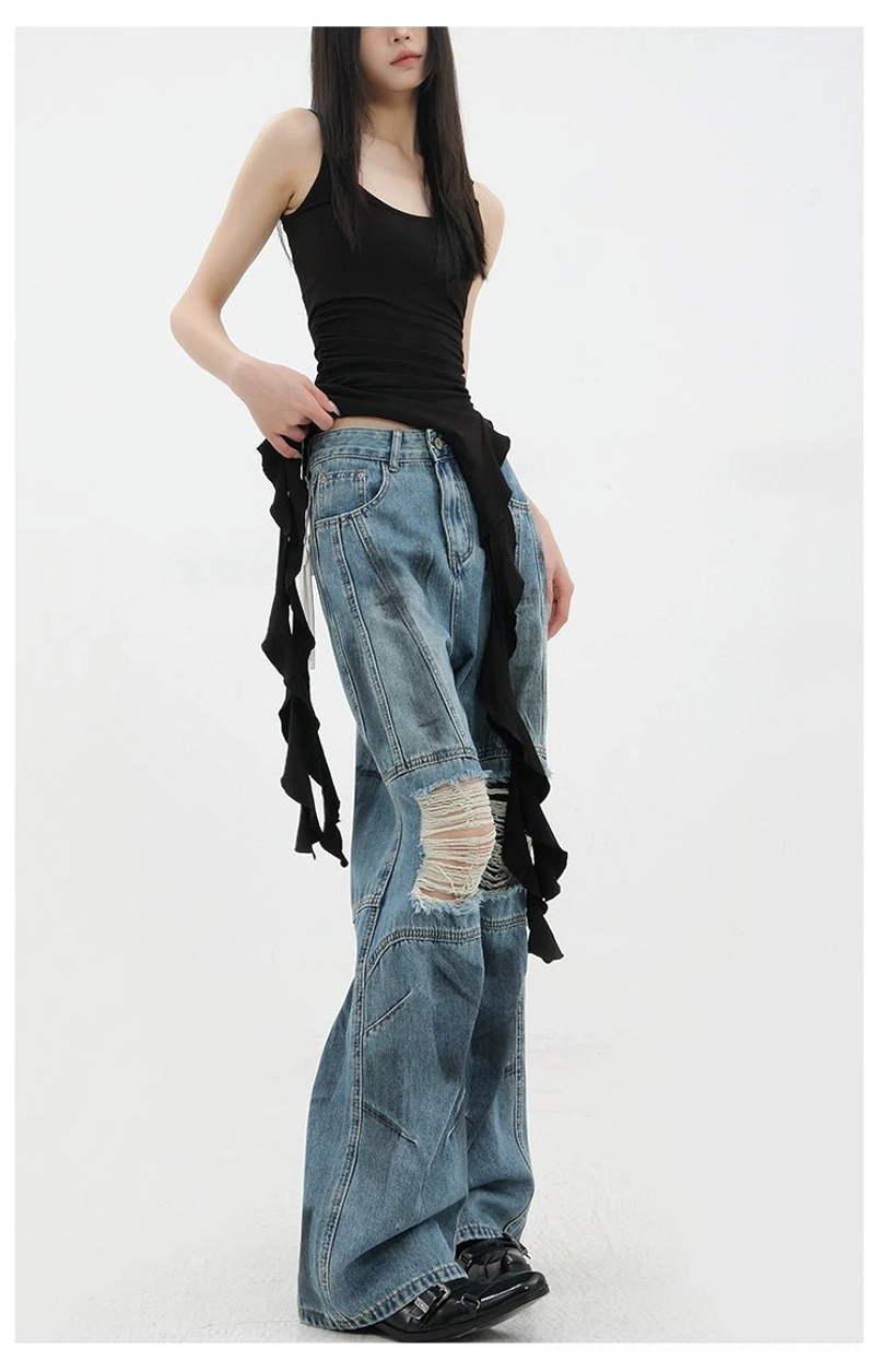Vintage distressed wide-leg jeans back pocket detail showing classic denim construction reinforced stitching and vintage wash finish characteristic of authentic denim craftsmanship