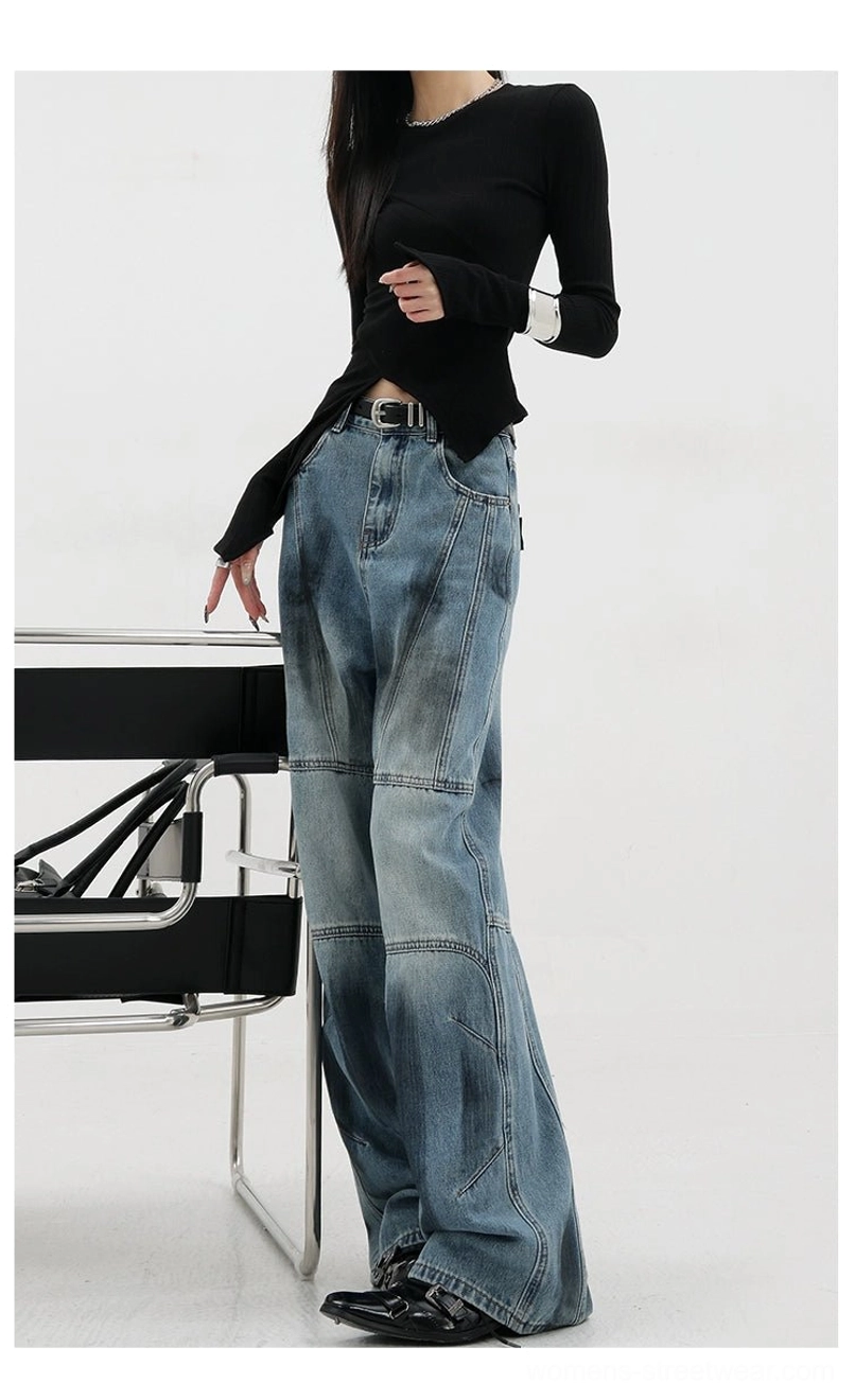 Vintage distressed wide-leg jeans detail photograph of blue non-painted style showing classic denim blue without extensive fading or painted effects for versatile styling