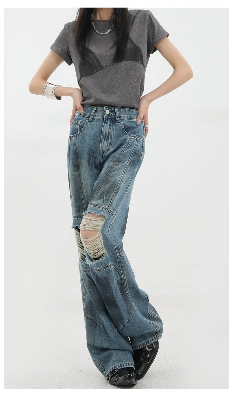 Vintage distressed wide-leg jeans front fly and zipper detail showing classic denim closure hardware and vintage finish characteristic of authentic grunge-inspired design