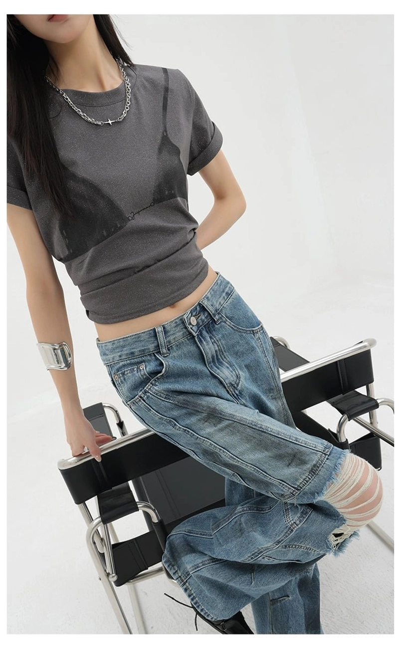 Vintage distressed wide-leg jeans inseam detail showcasing paneled construction multi-stitch seaming and relaxed fit engineering for authentic grunge aesthetic and comfortable wear