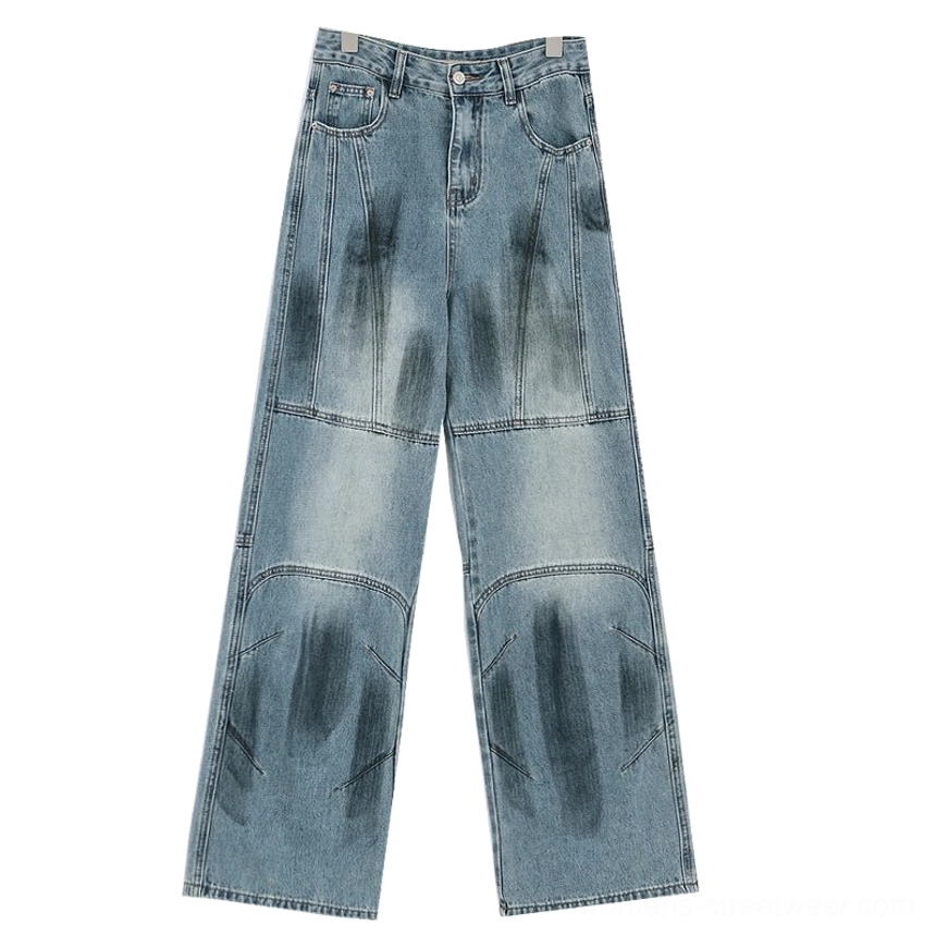 Vintage distressed wide-leg jeans blue non-distressed style detailed view showing clean silhouette vintage wash without aggressive ripped areas complete design