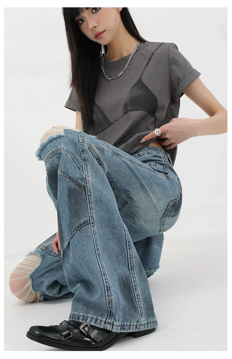 Vintage distressed wide-leg jeans paired with oversized hoodie showcasing balanced proportions and layering techniques for maximum grunge impact and contemporary street style