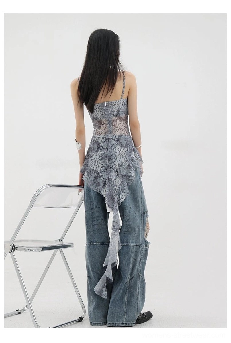 Vintage distressed wide-leg jeans production process behind-the-scenes showing dirt-dyeing distressing and construction techniques that create authentic vintage appearance