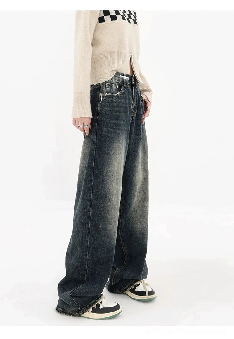 Vintage faded dark blue wide-leg jeans with raw frayed hem streetwear detail