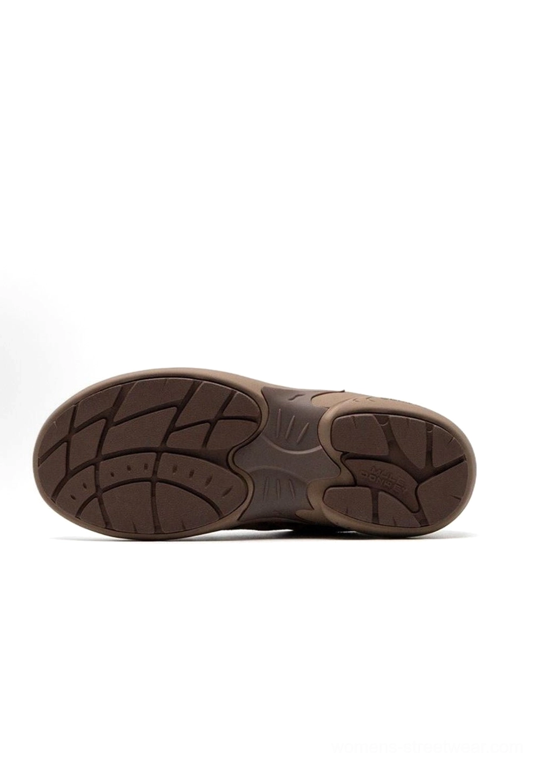 Dynamic angle product shot of vintage German trainer sneaker capturing movement perspective and three-dimensional design element visualization