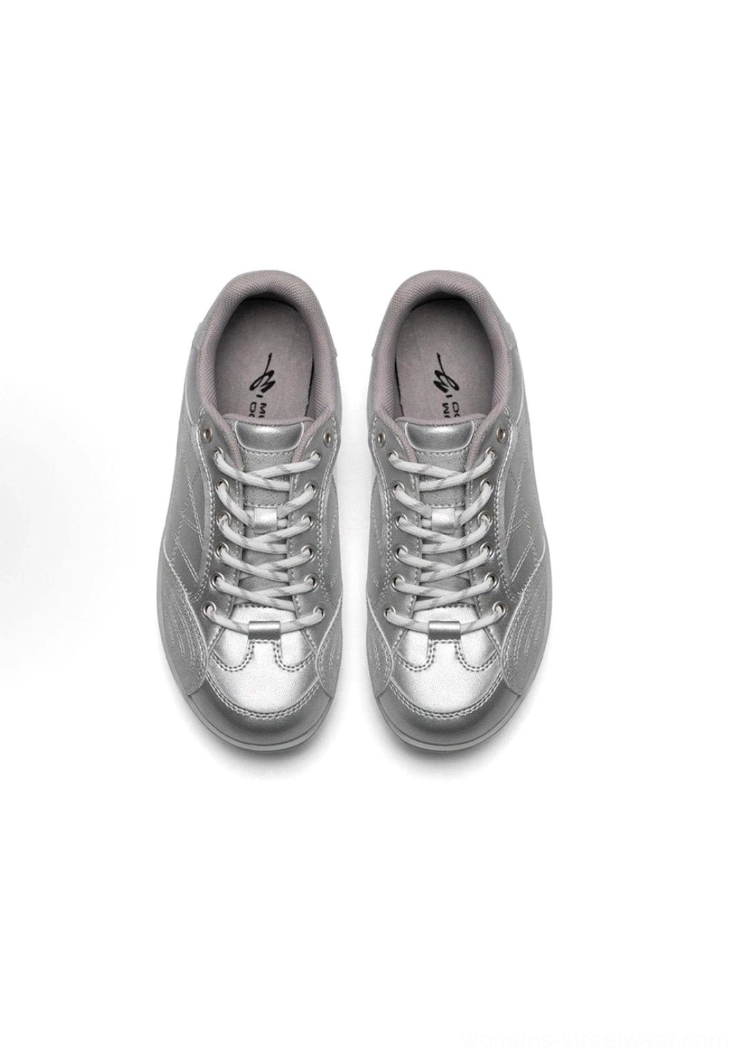Techwear inspired styling photography of vintage German trainer sneaker combined with urban technical fashion elements and contemporary design