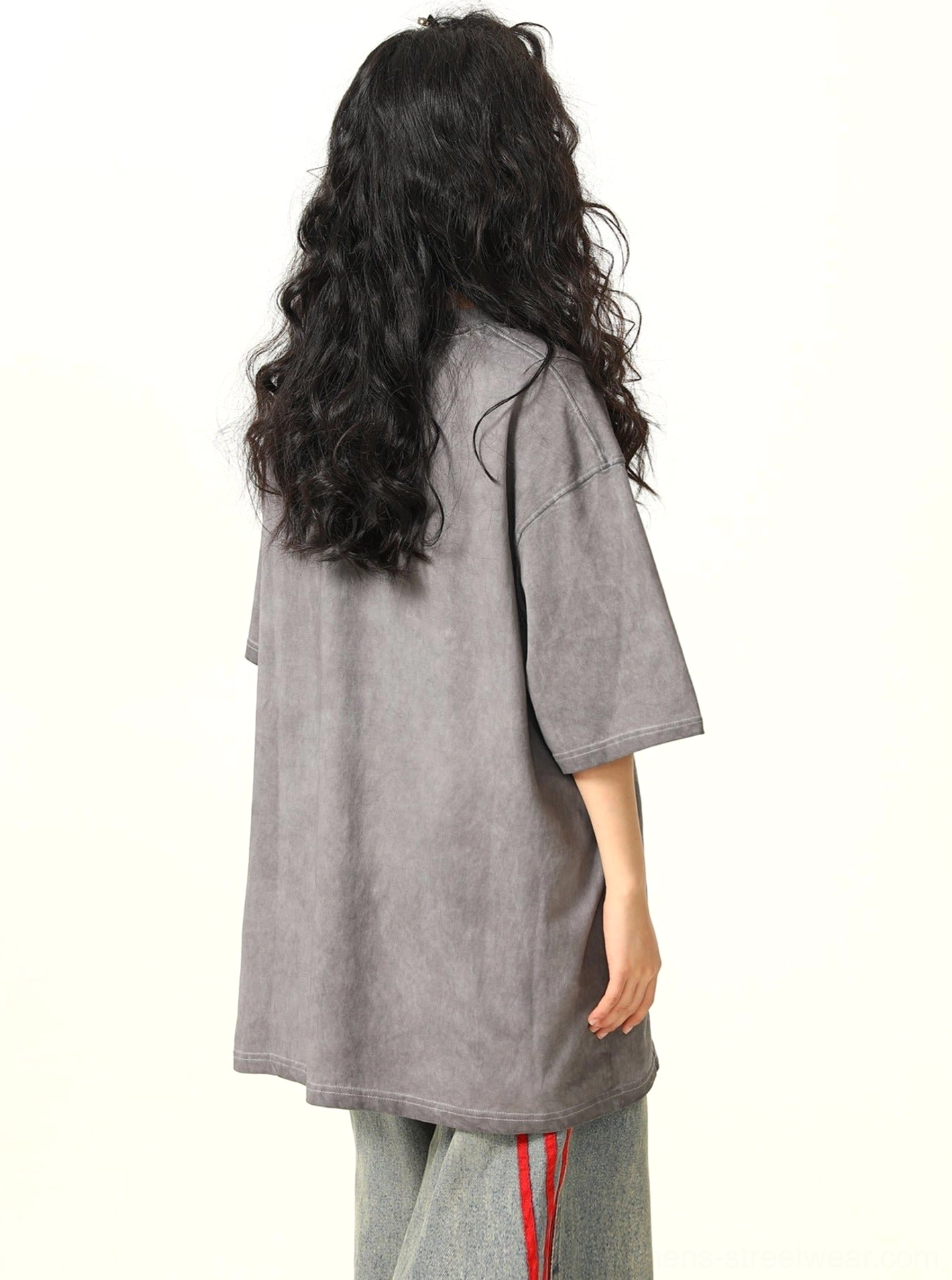 Back view showing the loose oversized silhouette, crew neck, short sleeves, and solid faded gray fabric of the fantasy streetwear T-shirt