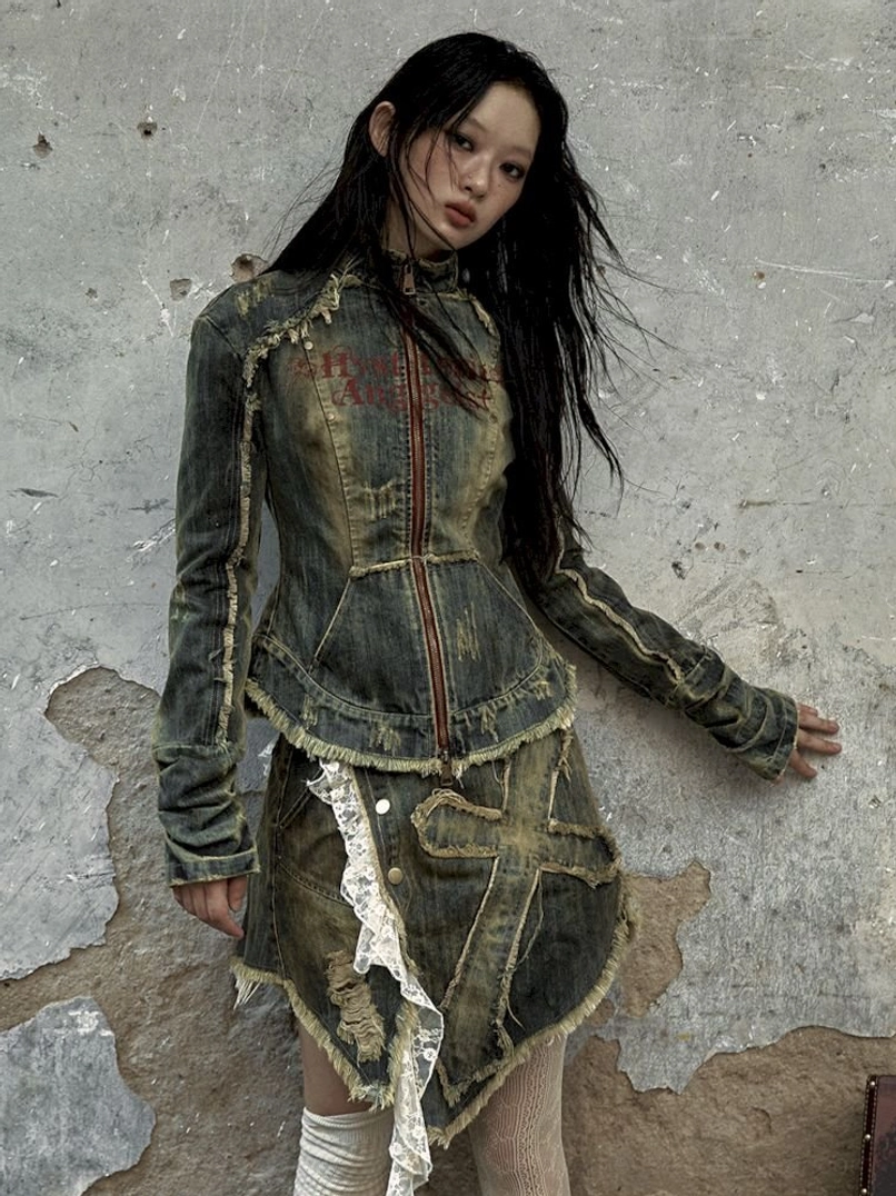 Vintage grunge distressed denim corset jacket with structured waist and raw denim detailing