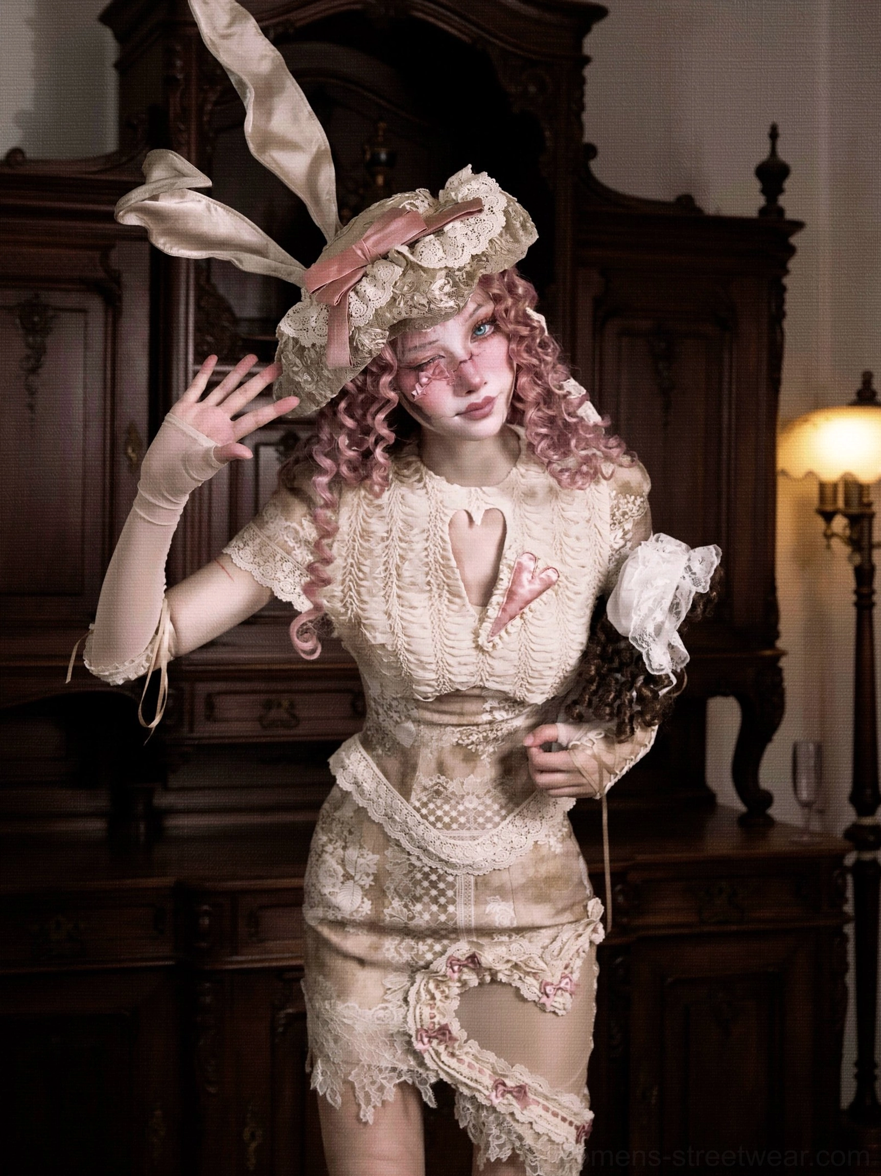 Close three-quarter view of a vintage lace heart cutout corset top with scalloped lace trim, ruched fabric, and bunny ear inspired styling