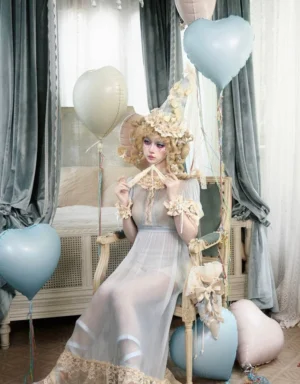 Vintage pale blue sheer lace ruffle empire maxi dress worn by a Lolita fashion model in a romantic retro bedroom