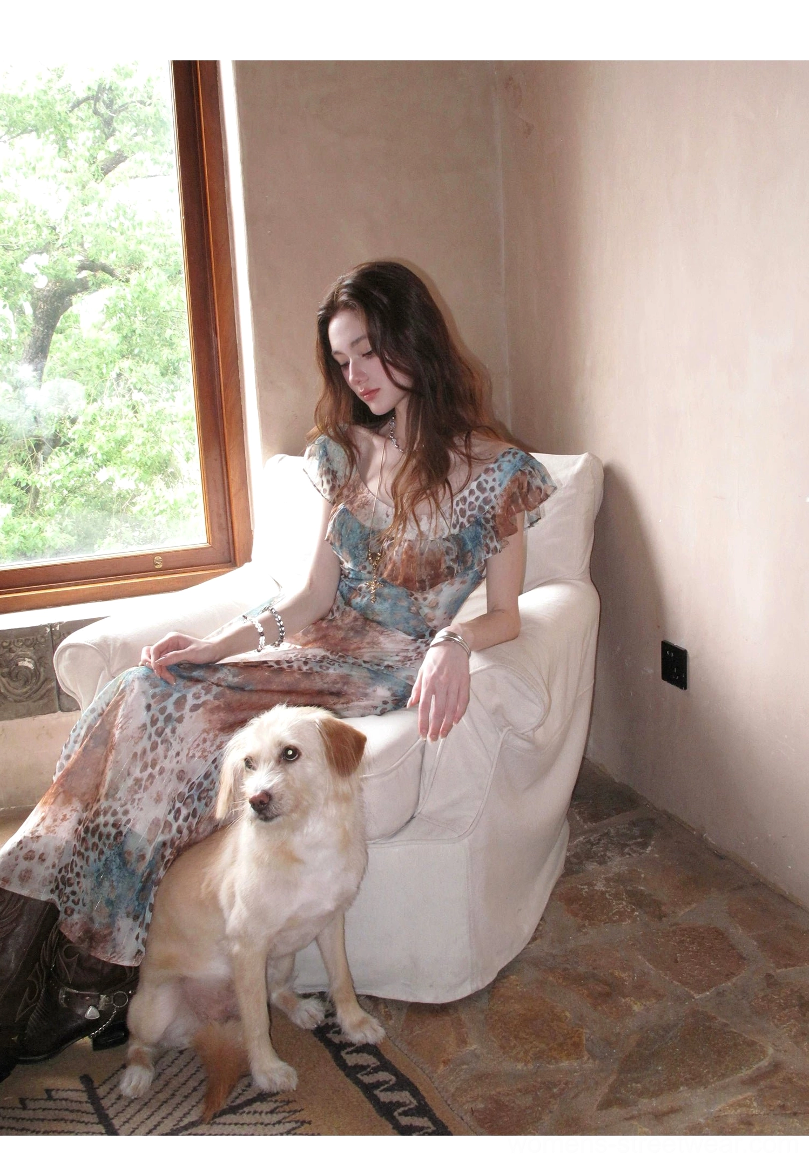 Side profile of a vintage-inspired leopard print maxi dress with layered ruffles, tied waist, V-neckline, and soft flowing chiffon fabric