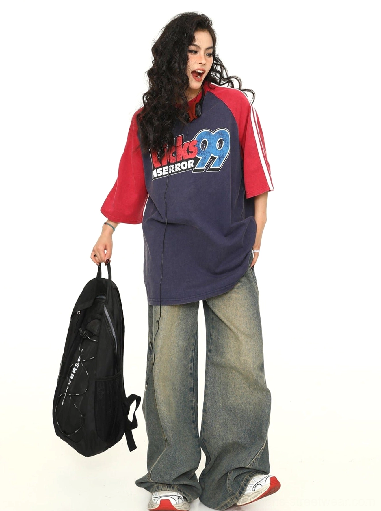 Vintage-style navy raglan graphic T-shirt with red short sleeves and a relaxed oversized streetwear silhouette