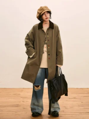 Khaki green oversized vintage streetwear trench coat with corduroy collar, single breasted buttons, wide leg ripped jeans, newsboy cap, and black tote bag