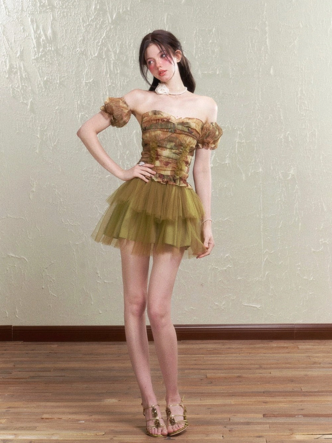 Vintage rose print ruched corset top and tulle mini skirt styled with gold strappy sandals in a side view