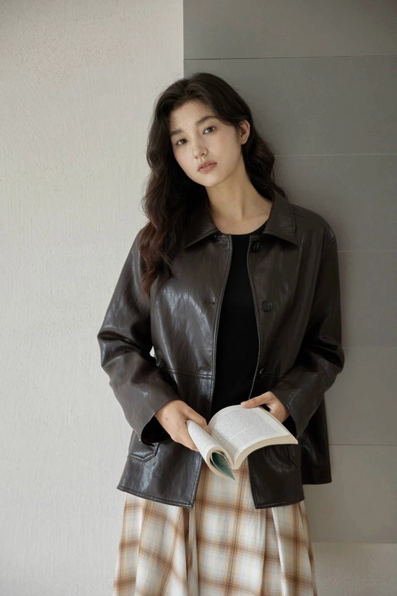 Vintage short leather jacket for women shown in a modern relaxed streetwear styling