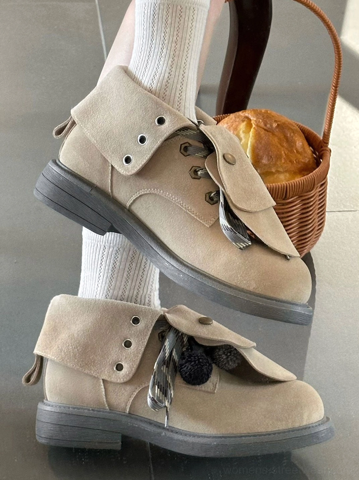 Vintage-inspired tassel lace-up ankle boots featuring a soft suede-look upper, buttoned foldover flap, plush lining, and stacked outsole