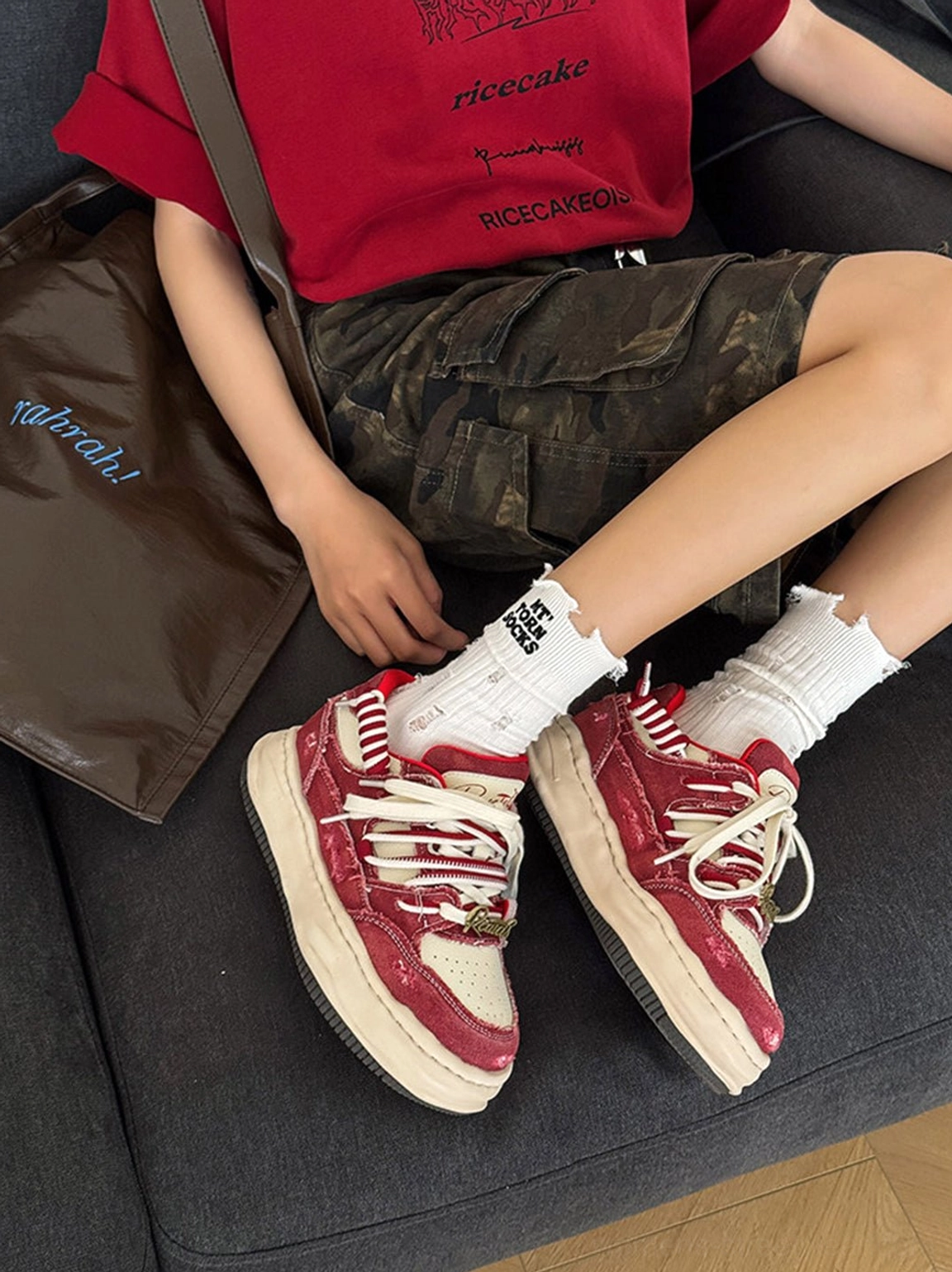 Vintage wash denim platform streetwear sneakers showing chunky sole and distressed texture in a detailed product image