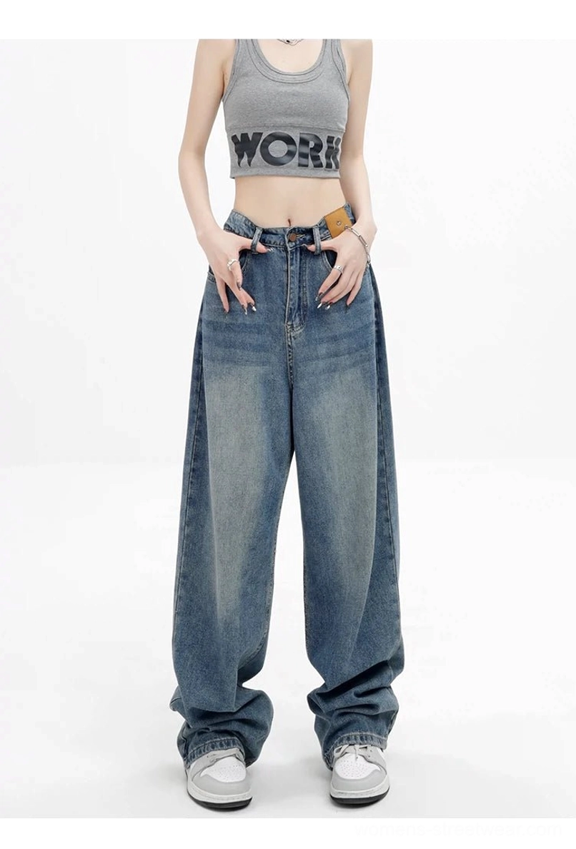 Vintage wash high-waist loose straight-leg floor-length jeans front view with crop top and white sneakers