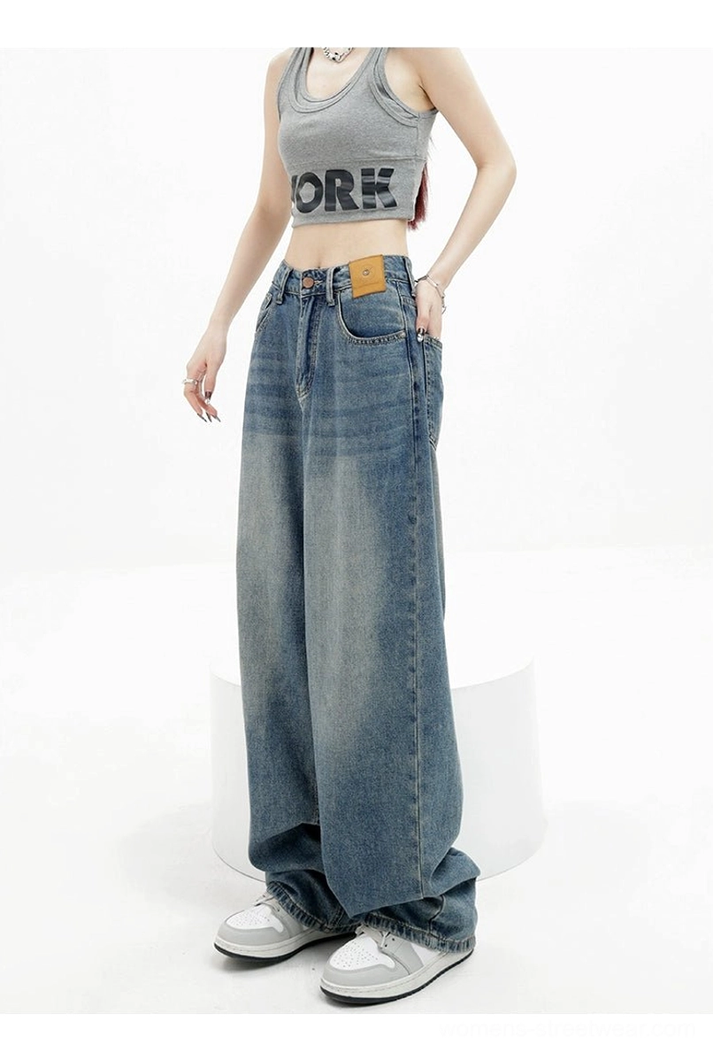 Vintage wash high-waist loose straight-leg floor-length jeans side view showing relaxed wide silhouette