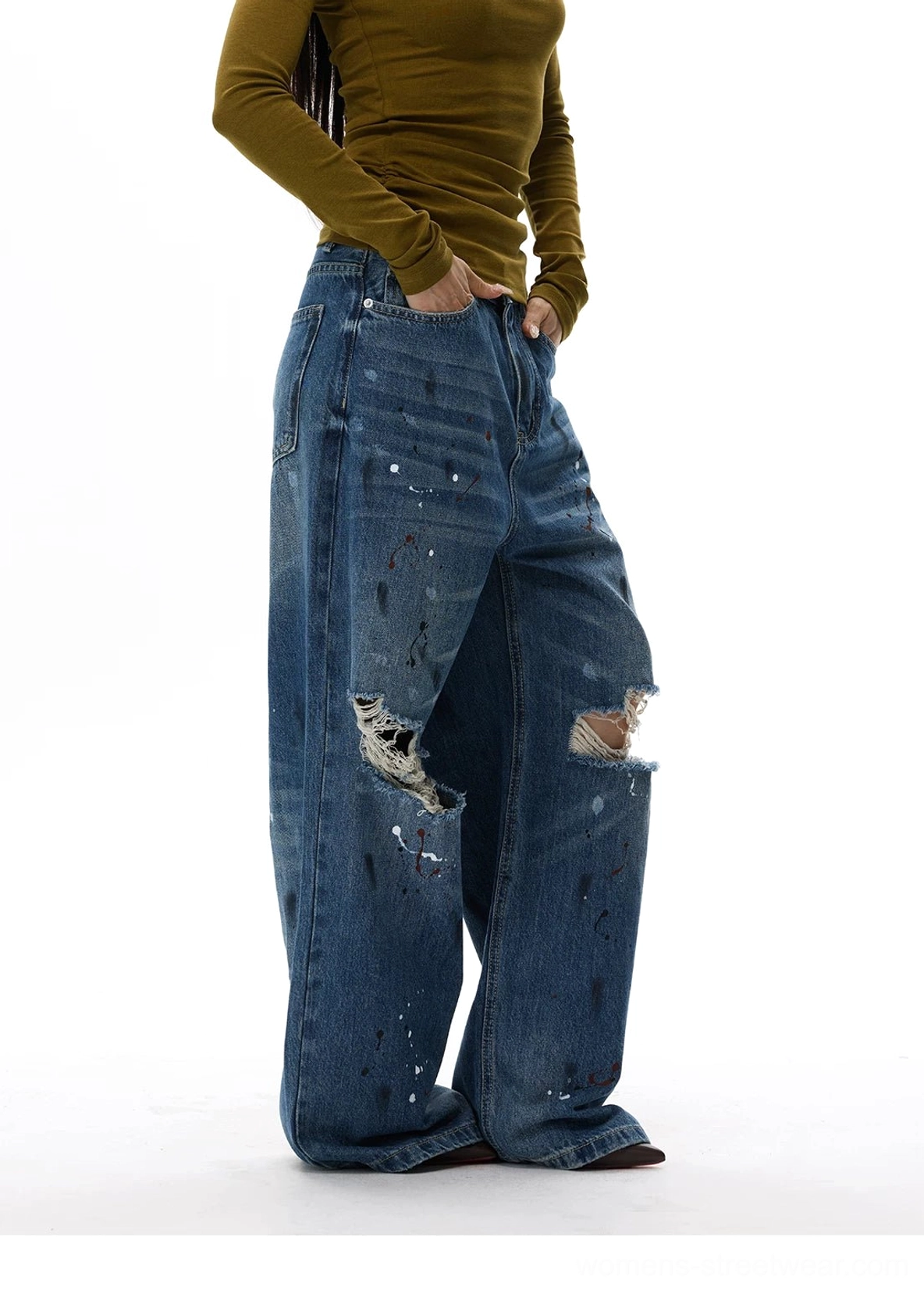 Vintage wash paint splatter jeans with relaxed wide-leg fit, grunge distressing, and bold early-2000s styling