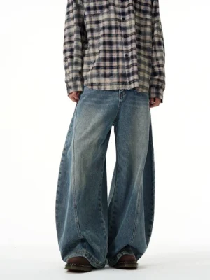 Vintage wash ultra wide-leg balloon jeans styled in a low-angle front full-body streetwear outfit