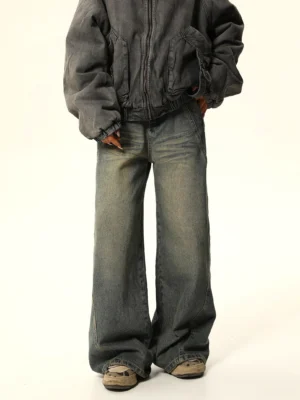 Front view of faded denim jacket styling with blue vintage wash wide-leg carpenter jeans in a Seoul streetwear outfit