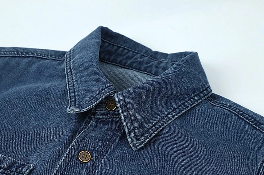 Vintage washed blue denim jacket shirt for women with relaxed streetwear proportions and timeless casual appeal