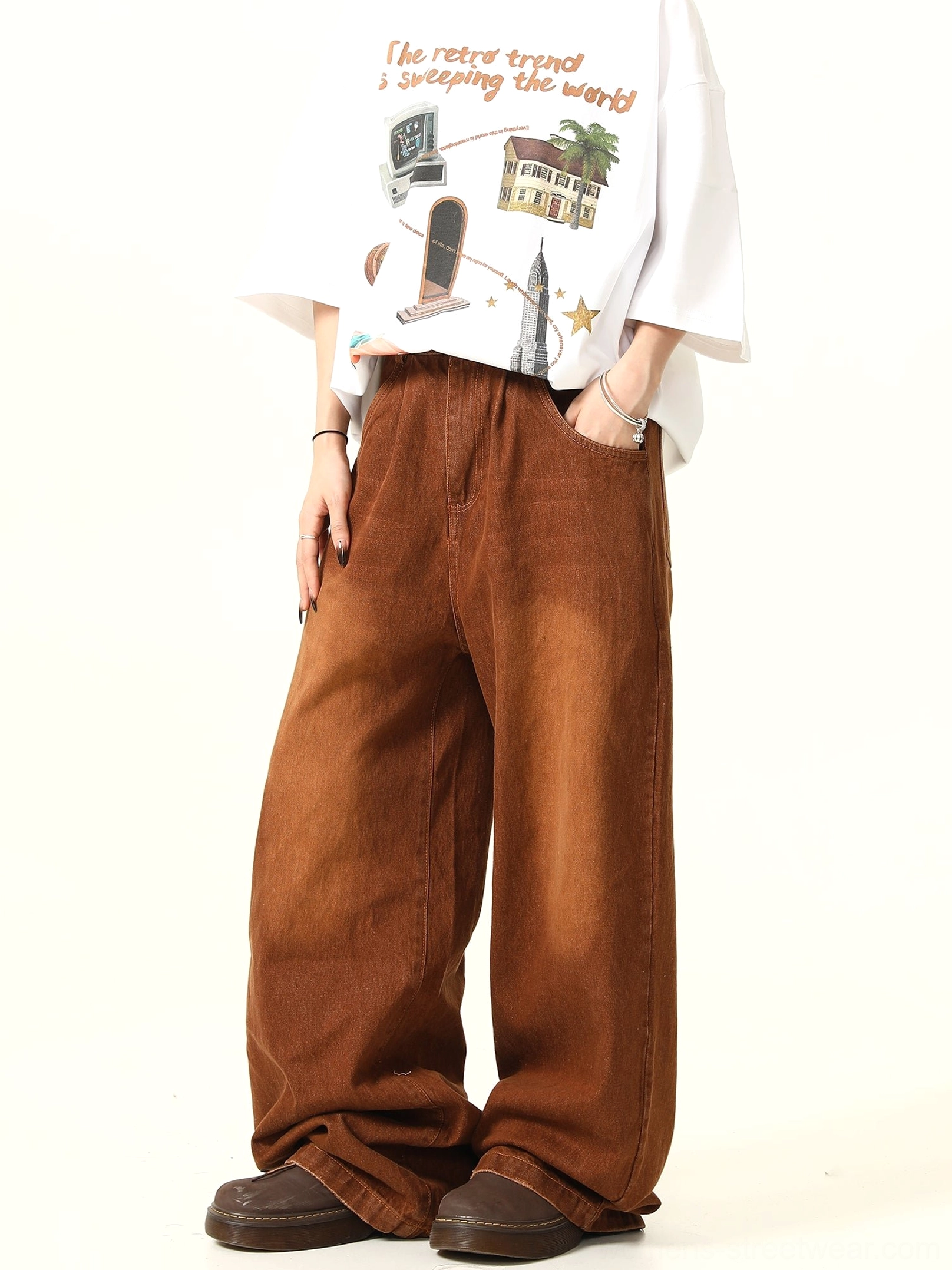 Side view of vintage washed brown wide leg denim jeans showing the straight oversized leg silhouette
