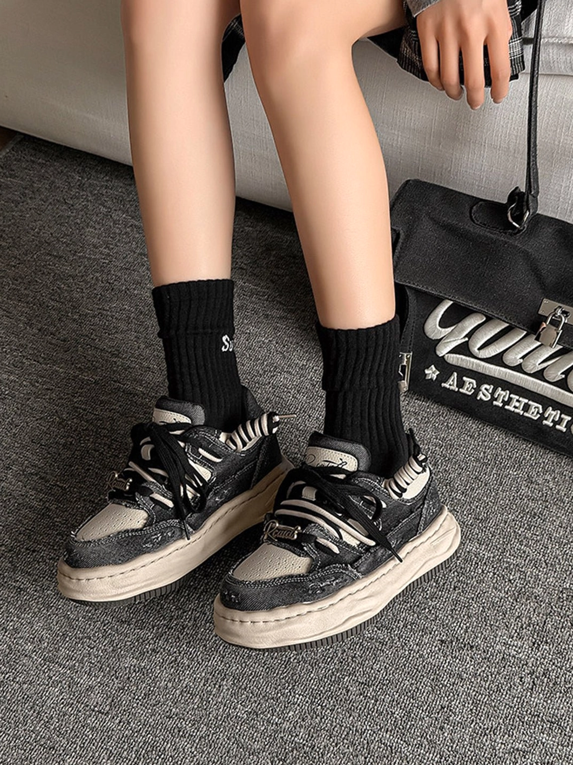 Vintage washed denim sneakers with chunky outsole and classic lace-up design for relaxed urban dressing