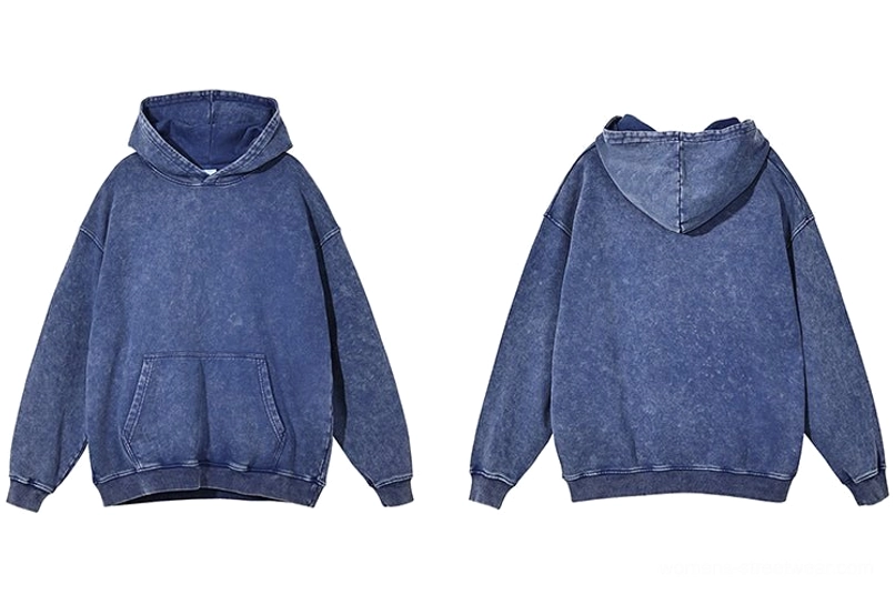 Vintage washed oversized hoodie close-up featuring textured faded fabric and contrast stitched construction
