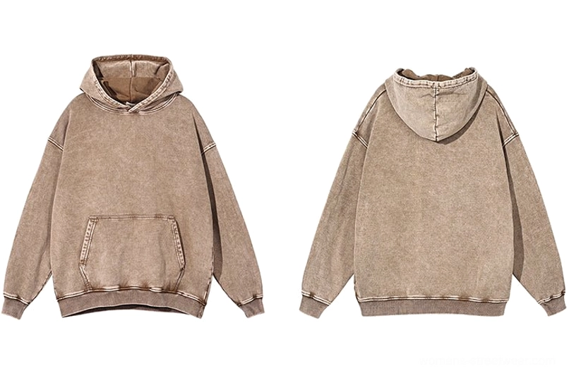 Vintage washed oversized hoodie showing relaxed fit, ribbed cuffs, and front kangaroo pocket detail