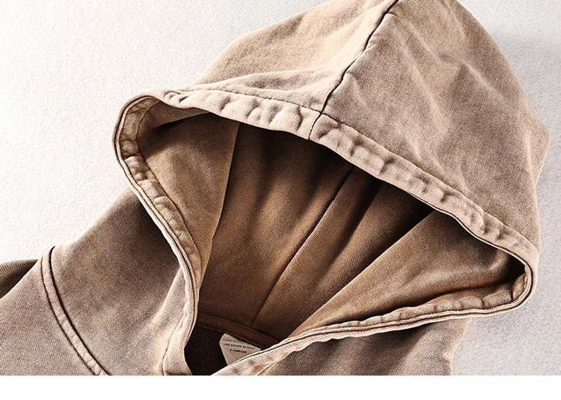 Close-up of tan brown vintage washed oversized hoodie hood with contrast seam construction and soft faded finish