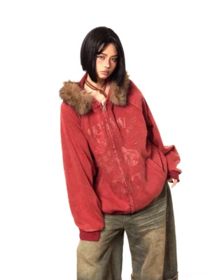 Vintage washed red faux fur trim hooded zip-up jacket with oversized Y2K streetwear fit, chest graphic, ribbed cuffs, and black boots