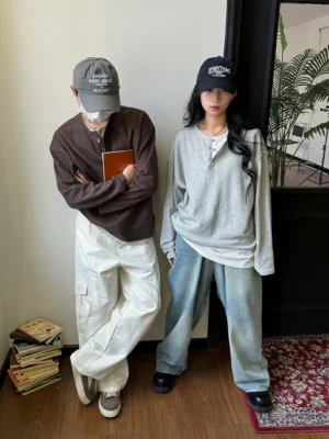Side view of unisex waffle knit Henley shirts styled with cargo pants for a relaxed Korean streetwear outfit