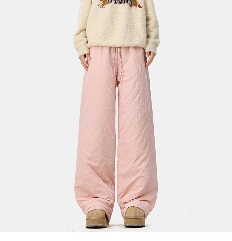 Warm convertible wide-leg pants combining a sporty crinkled shell with a soft faux-fur fleece lining