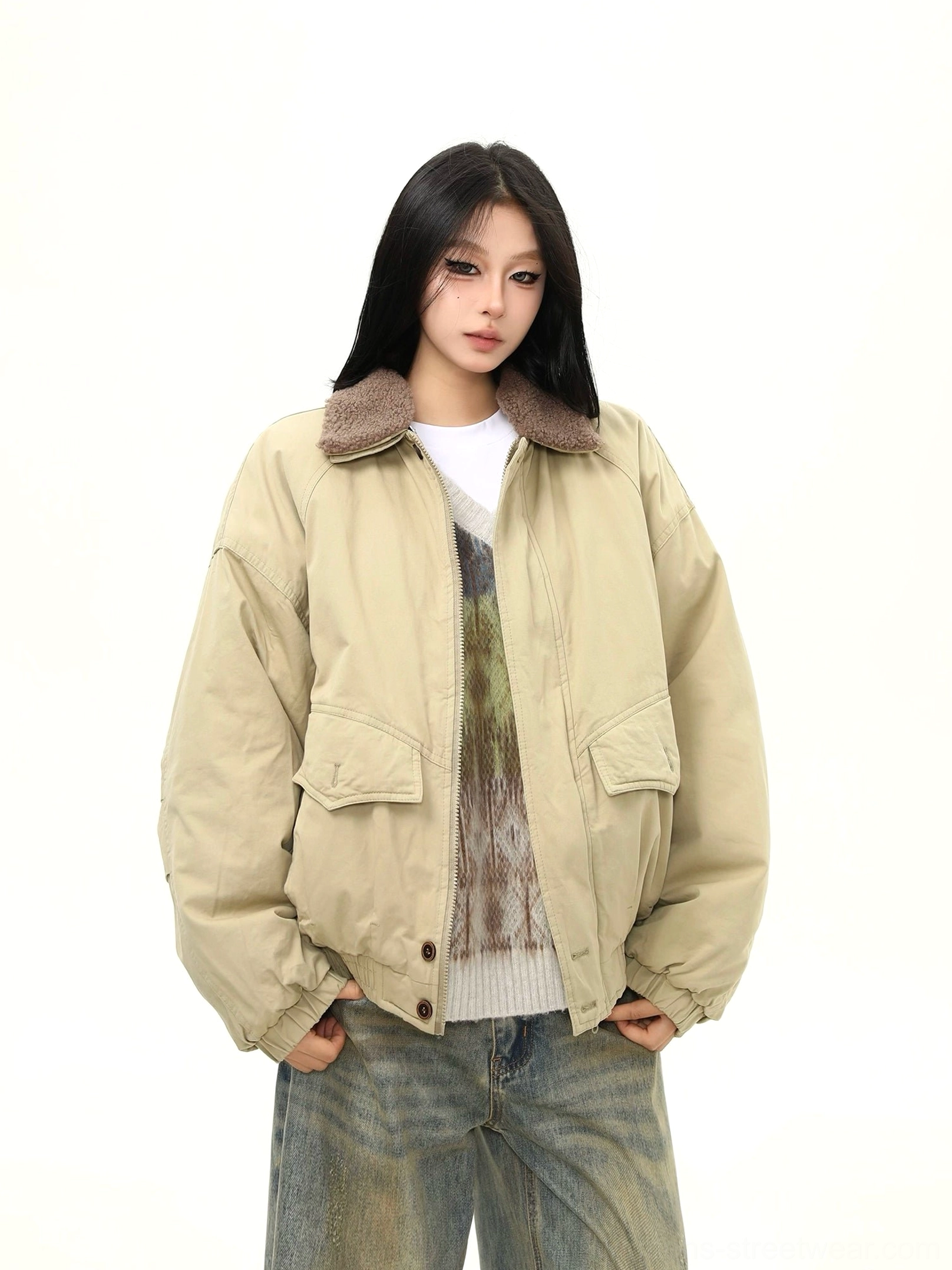 Front view of a warm khaki padded bomber jacket with brown sherpa collar, structured patch pockets, and ribbed sleeve cuffs