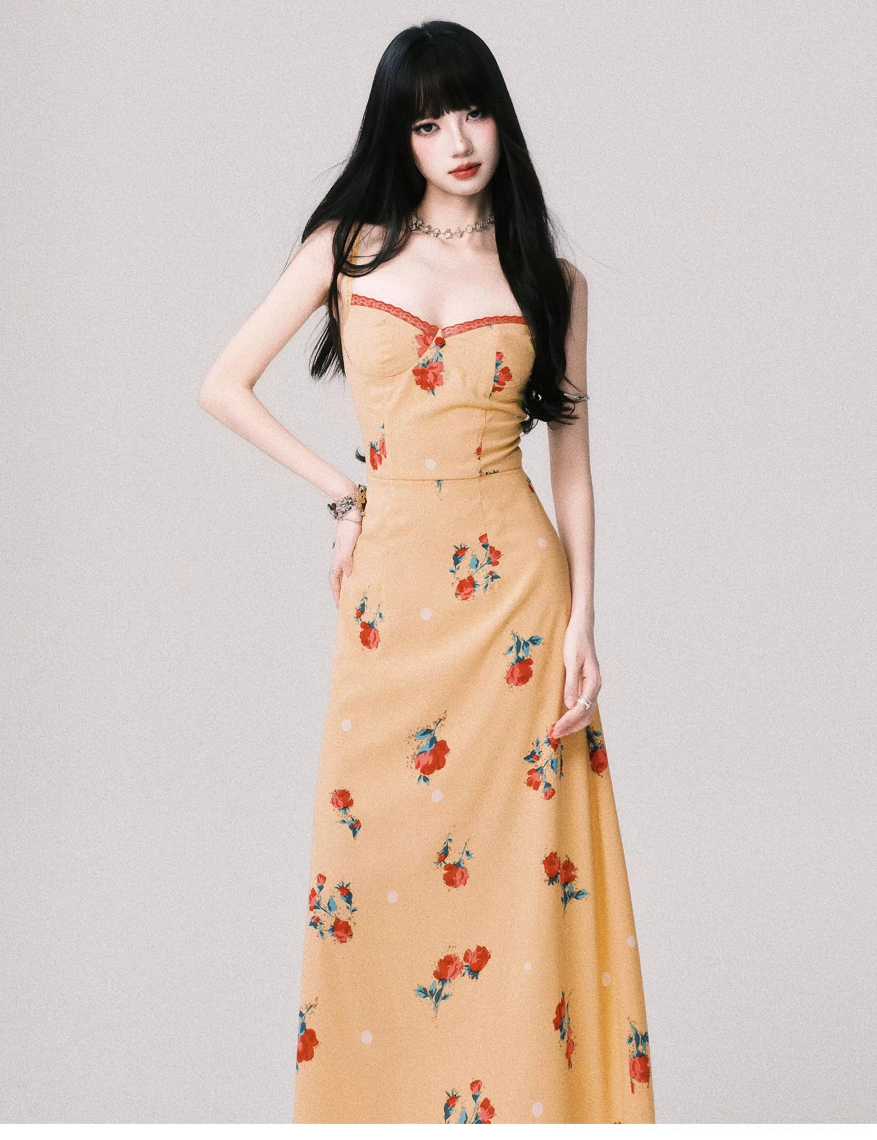 Warm yellow floral maxi dress in a three quarter view highlighting the fitted waist and flowing full length skirt