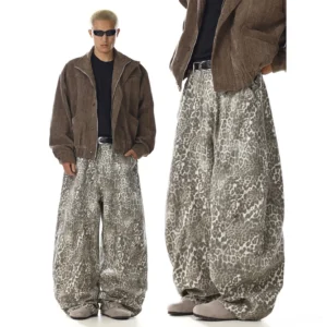 Leopard print washed barrel-leg utility pants with an oversized wide-leg silhouette and textured finish styled in a modern streetwear outfit