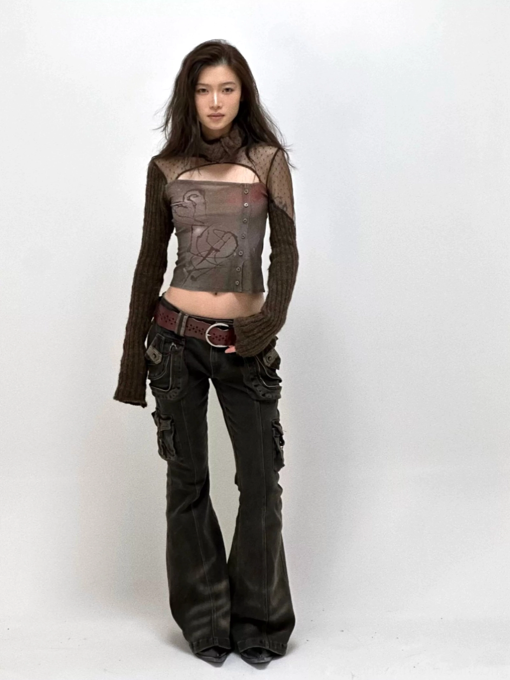 Washed black low-rise cargo flare jeans for women featuring a dramatic Y2K flared silhouette and oversized utility pocket styling