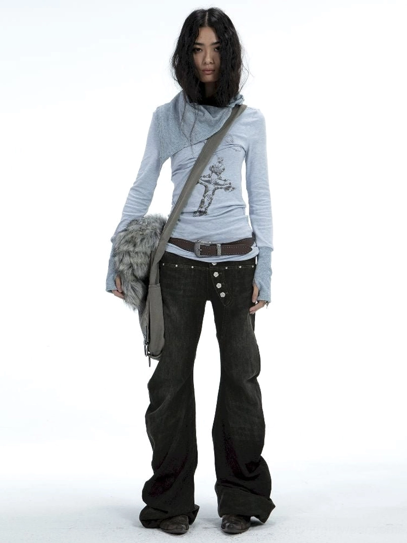 Full-body front view of women’s washed black Y2K low-rise flare jeans styled with a cross graphic top