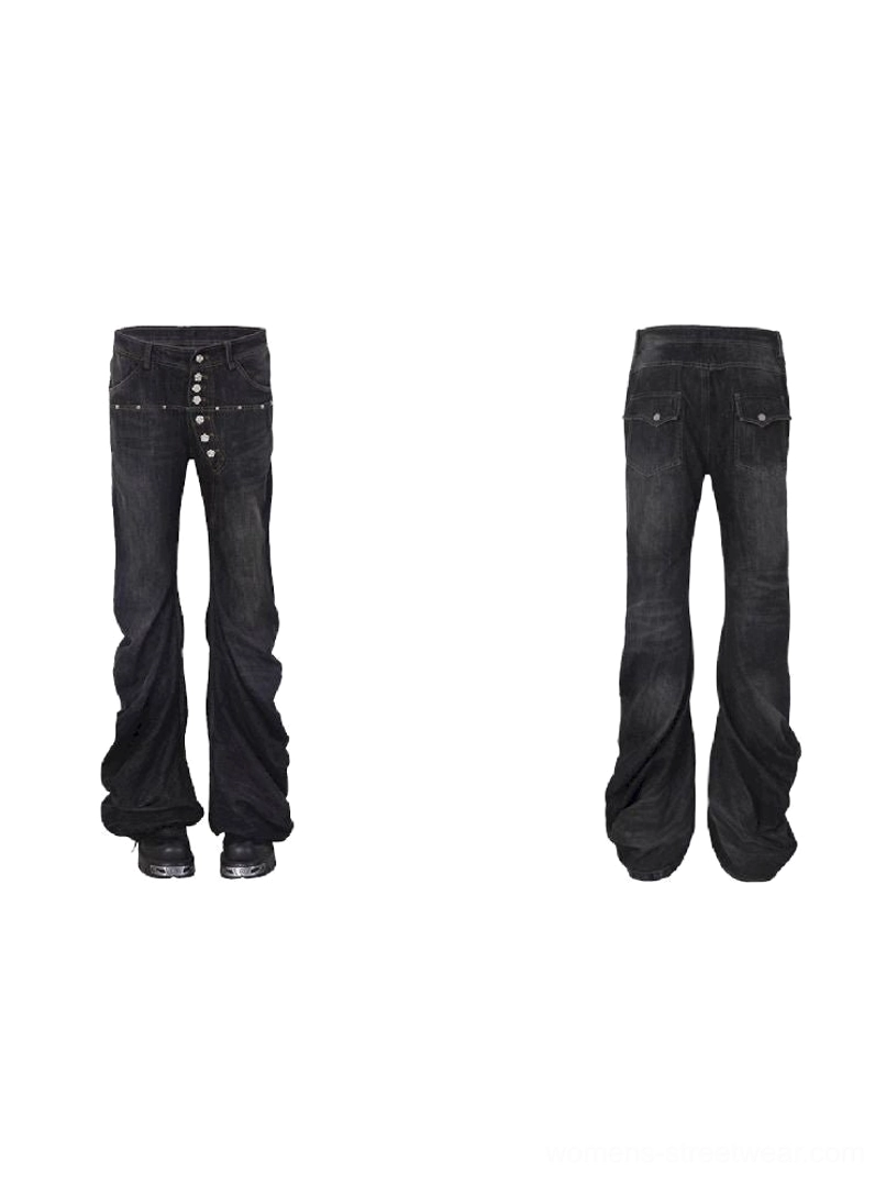 Washed black low-rise flare jeans for women with long wide legs and silver metal hardware