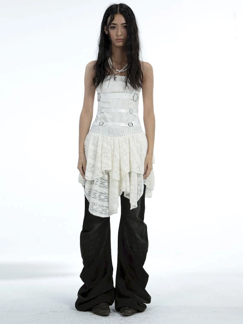 Women’s washed black multi-button flare jeans with wide floor-length legs styled with a white camisole
