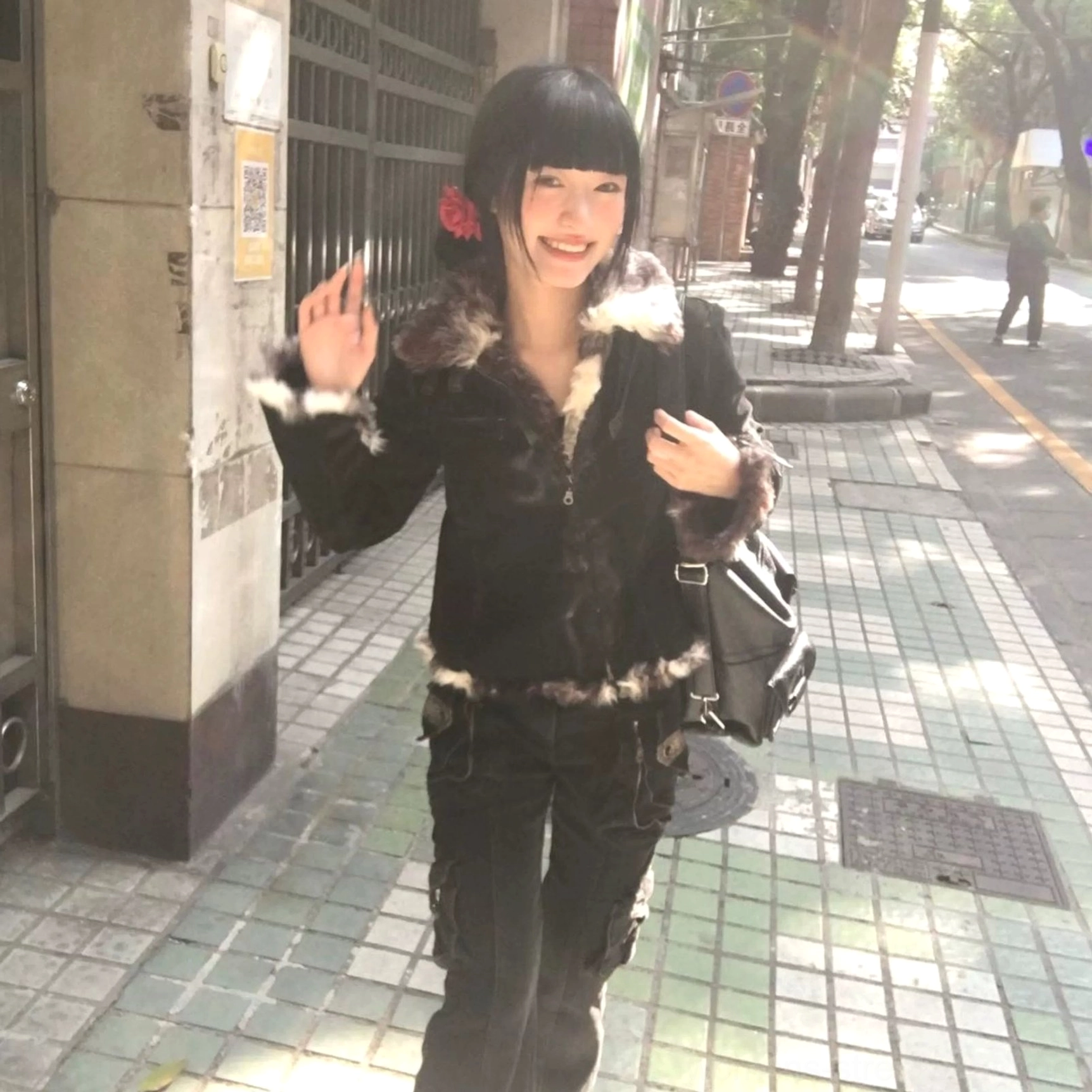 Washed black streetwear cargo jeans with a low-rise waist, moderate stretch denim, sculpted hip fit, and statement flared legs
