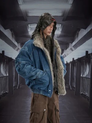 Three-quarter side view of a washed blue denim bomber jacket worn open to reveal the plush faux-fur interior, styled with cargo pants for Korean streetwear